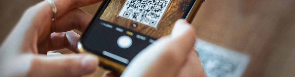 Picture of someone scanning a QR code with their phone